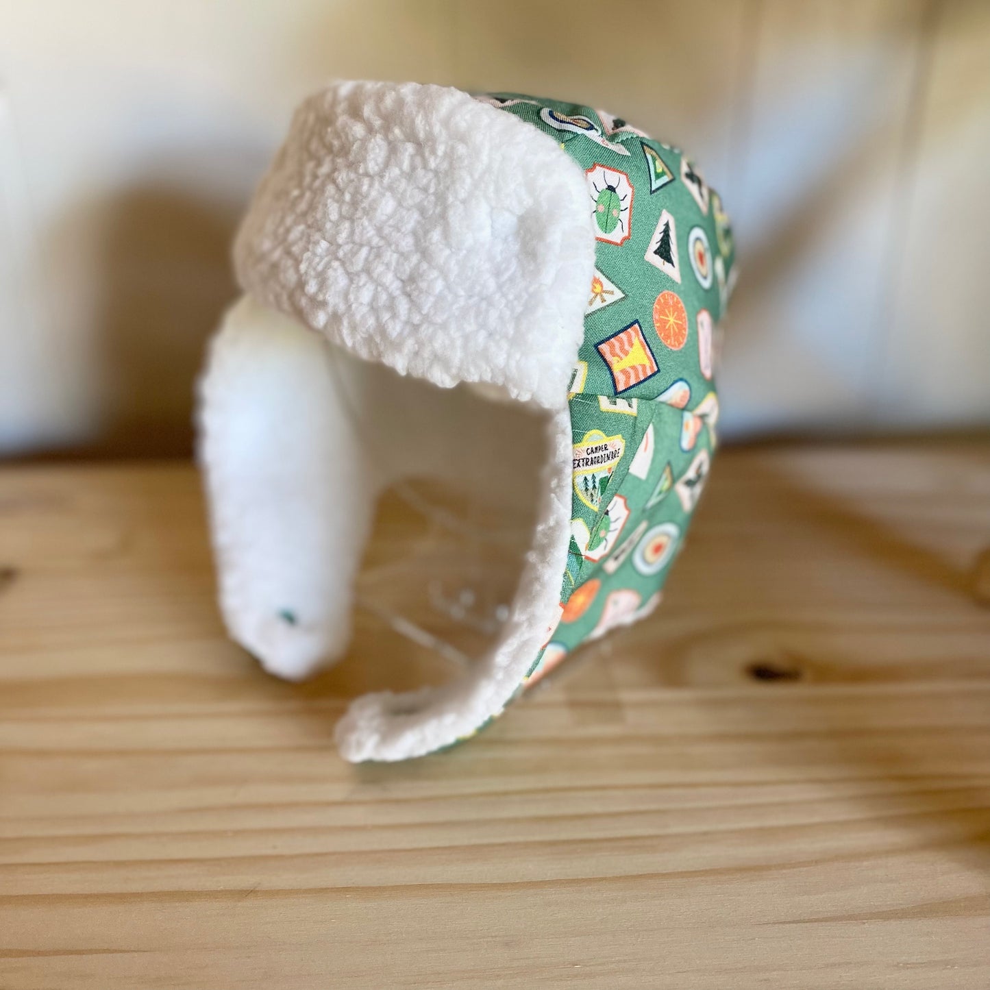 Green Badges & White - Trapper Hat (Size up to 12 Months)